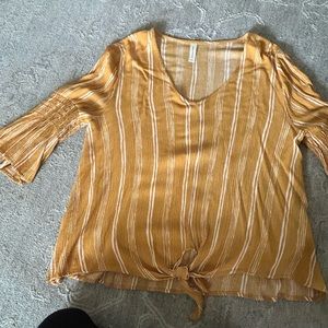 Gold and off white blouse. Tie waist. Gathering detail on sleeves.